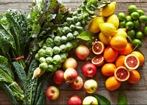 a group of fruits and vegetables on a wood surface Healthy Weight Loss Diets Isle of Isla